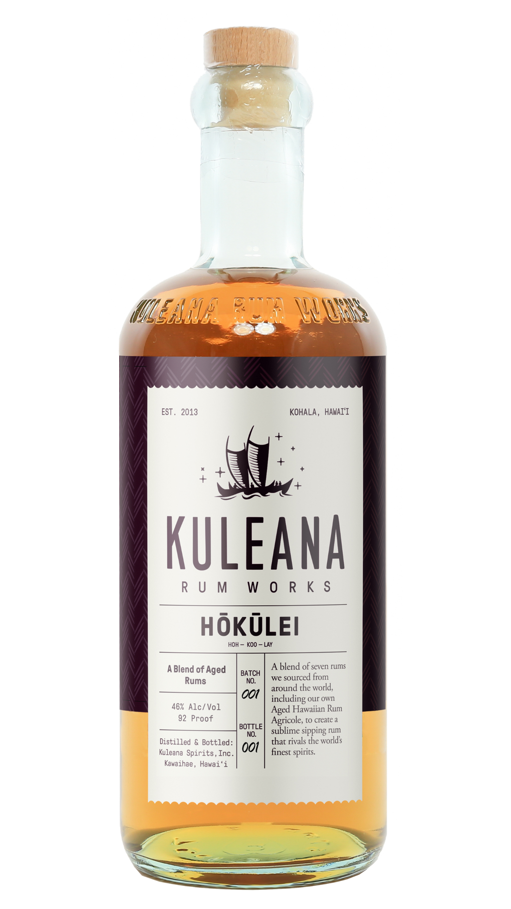 A bottle of Kuleana Rum Works Hóküliéi rum on a plain white background. The clear glass bottle shows the amber-colored liquid inside, topped with a light brown cork.