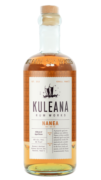 A bottle of Kuleana Rum Works Nanea rum with amber liquid, a white label, and a cork stopper, shown on a plain white background.